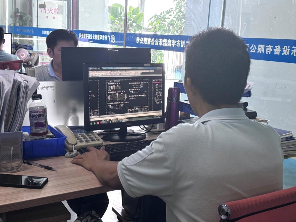 Engineer drawing the internal electronic circuit board of an amusement product