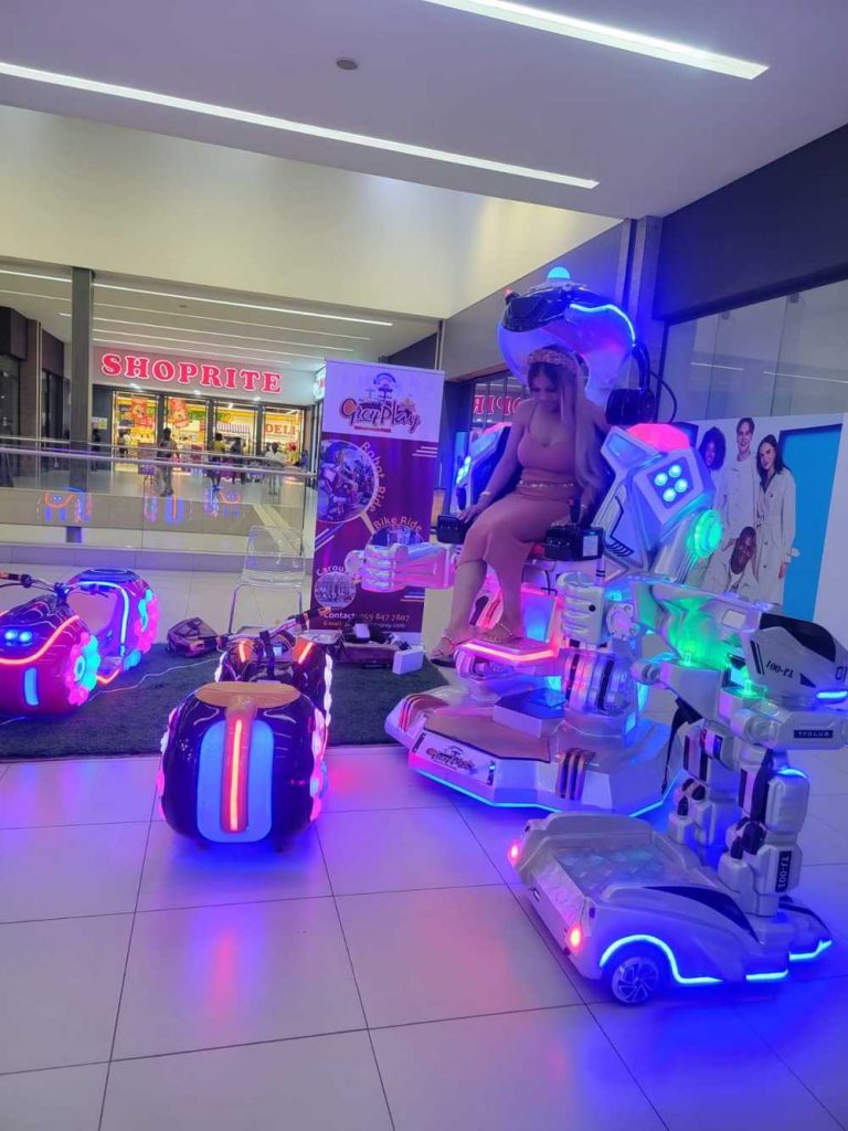 sexy woman riding walking robot in ghana